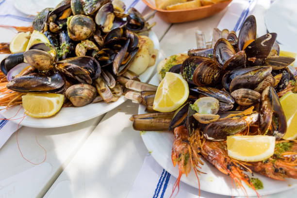 Mix of spicy shrimps and shellfish cooked with parsley, garlic and lemon .Spanish restaurant table
