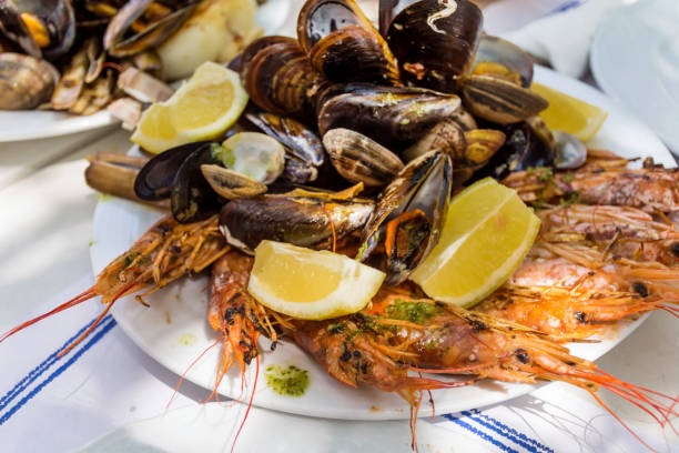 istock Shrimps and shellfish cooked with parsley, garlic and lemon 1998051813