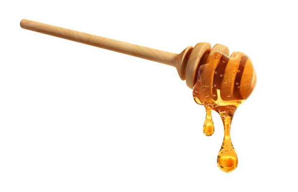 istock Wooden honey dipper with honey 1998084357
