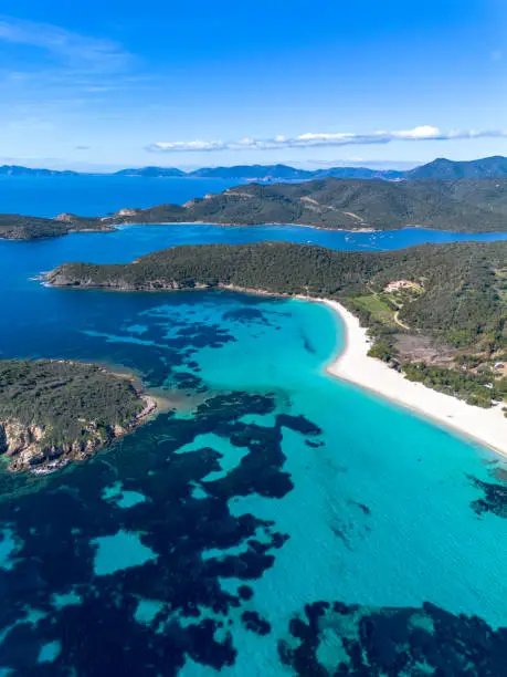 Photo of Tuerredda beach seen from above with a drone, surrounded by its famous turquoise sea, on the south-west coast of Sardinia. Coast of Tuerredda bay, Teulada, Sardinia, Italy.