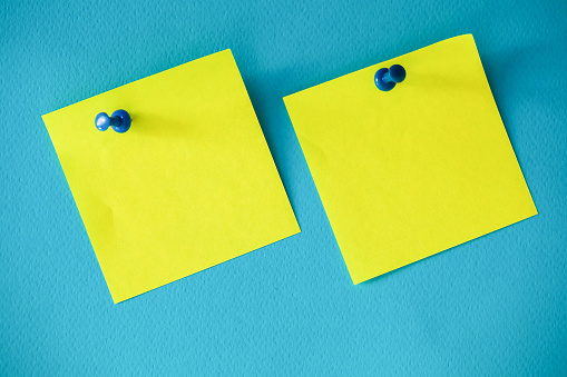 Yellow Post-its on Blue Background, Empty Text Area Reminder