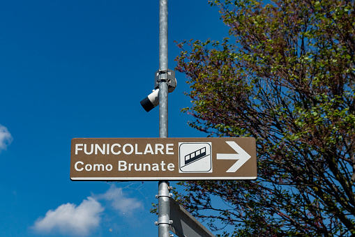 Sign for the funicular railway to Brunate on the banks of Lake Como.