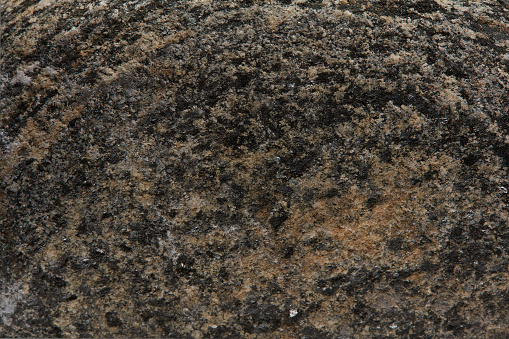 macro photography of natural mineral from geological collection - raw green aventurine stone on white background