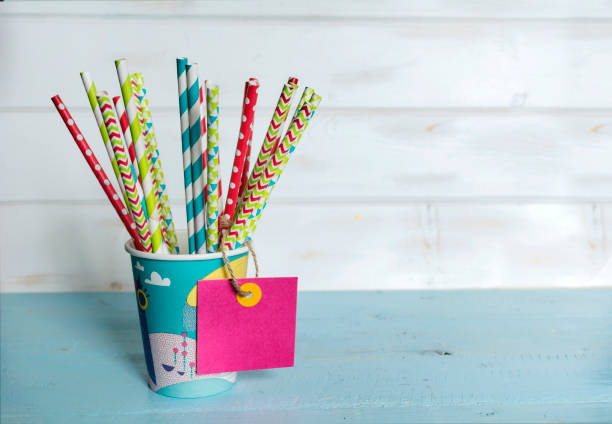 istock Colorful party paper cups and straws 1998130540