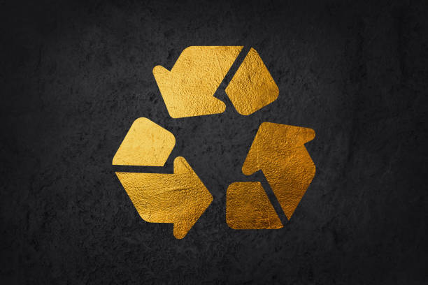 istock Gold Recycle symbol icon isolated on black background. Circular arrow icon. Environment recyclable go green. Long shadow style. Vector. 1998143694