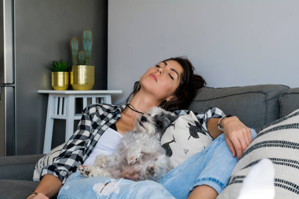 istock Woman napping with her dog 1998144784
