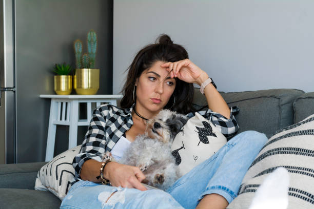 istock Sad Woman  using her phone at home 1998144788