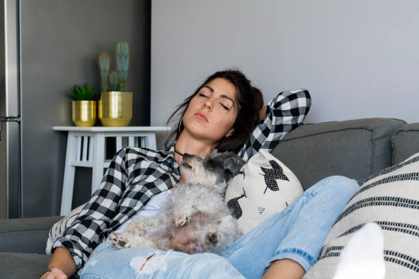 istock Woman napping with her dog 1998145303