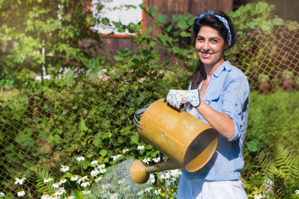 istock Young happy woman gardening 1998149145