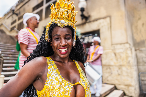 Portrait of a mid adult woman at a street carnival party