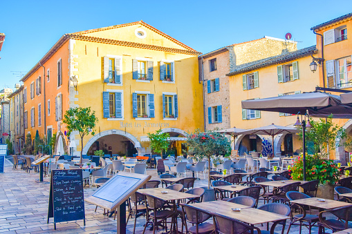 Valbonne, France - November 6 2019: daytime view of town square Place des Arcades in Valbonne Village.