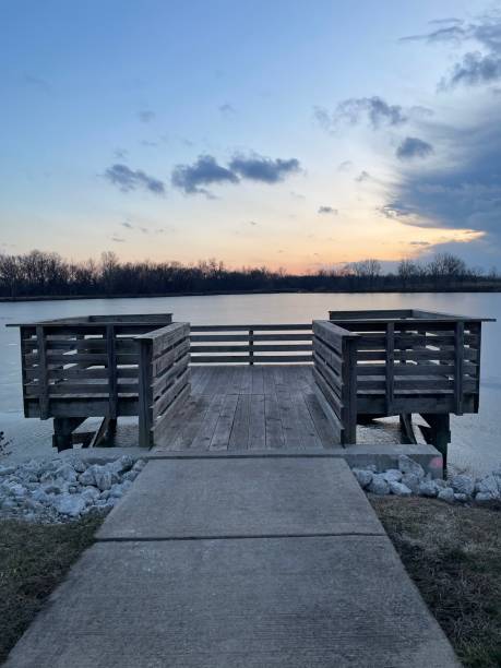 istock Peaceful Lakeside Wooden Dock at Sunset 1998202694