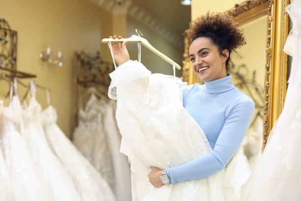 istock Future bride choosing her wedding dress 1998208768