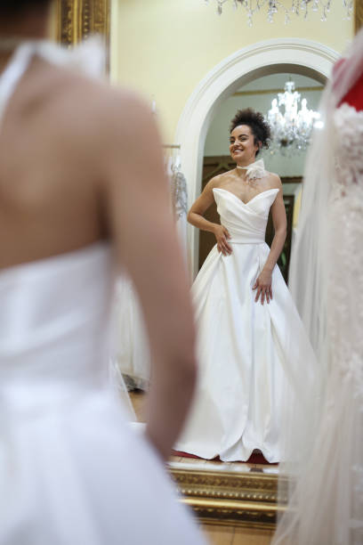istock Trying on a wedding dress 1998210987