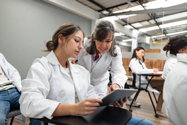 istock Teacher helping a medical student in class 1998218826