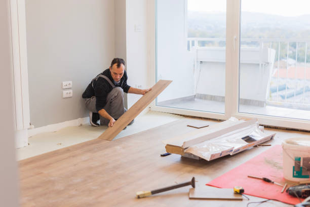 istock Carpenter adjusting hardwood floor 1998219390
