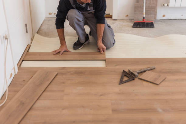 istock Handyman installing hardwood floor 1998219928