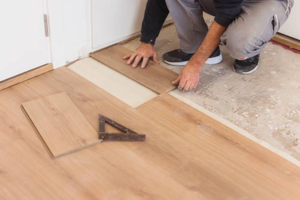 istock Handyman installing hardwood floor 1998220453