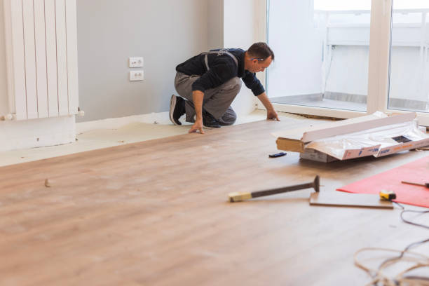istock Carpenter adjusting hardwood floor 1998220983