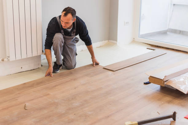 istock Carpenter adjusting hardwood floor 1998222526