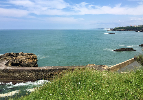 View of the ocean and lighthouse on the summer day. Biarritz. France.