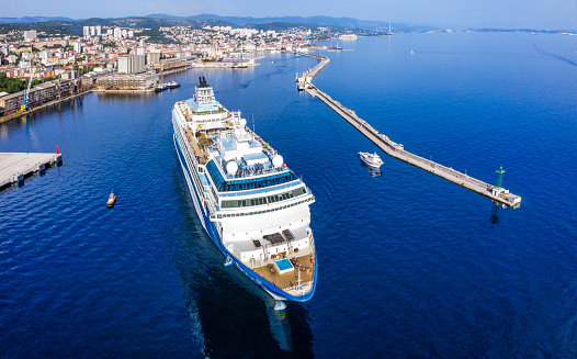 Rijeka, Croatia - June 5, 2022: Cruiser sails from port of Rijeka