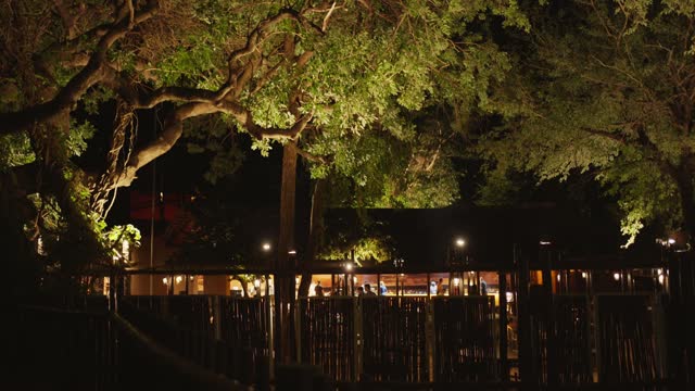 Restaurant illuminated at night in a wildlife reserve lodge