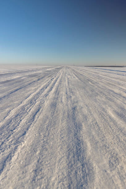 istock a slippery and dangerous road covered with snow and ice 1998280791