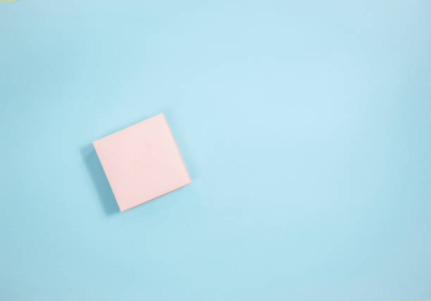 istock Holiday pink gift box on light pink background. Flat lay. Copy space. 1998285661