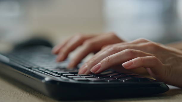 istock Manager hands typing desktop keyboard closeup. Journalist woman writing article. 1998298675