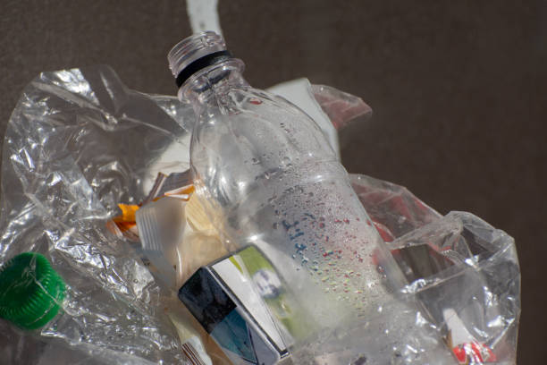 istock A pile of garbage: empty plastic bottles, cups. Close-up photo. 1998317759