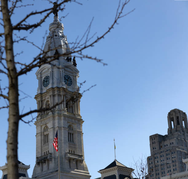 Philadelphia, Pa. USA, Feb. 4, 2024: Philadelphia City Hall tower behind a tree, Philadelphia, Pa. USA