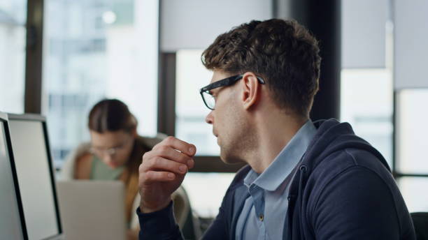 istock Overwhelmed manager working computer closeup. Tired thoughtful man rubbing eyes 1998364782