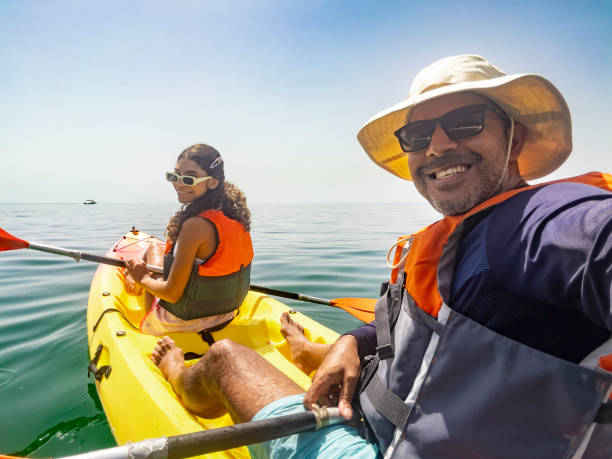 istock Tourists taking a selfie in kayak 1998365329