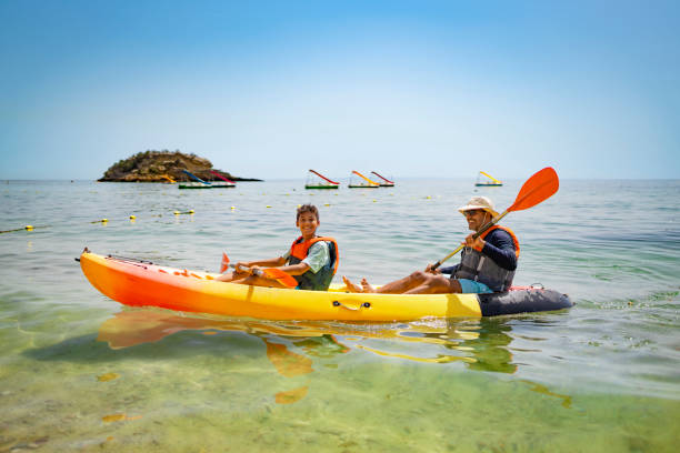 istock Family canoeing at Praia do Creiro 1998365841