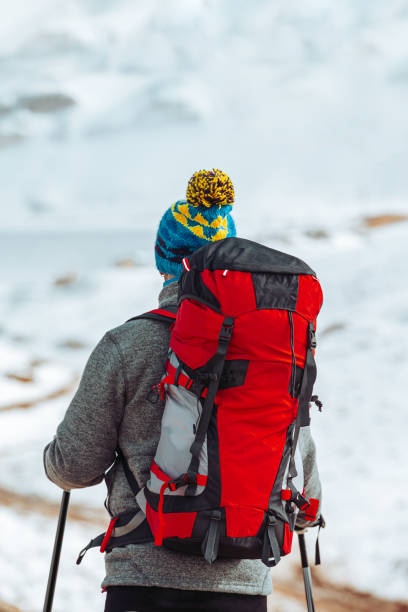 Winter Expedition. Tourists exploring mountain trails. Fully equipped and charged with adrenaline. Fresh, cold air fills the lungs. Freedom and Endurance concept.
