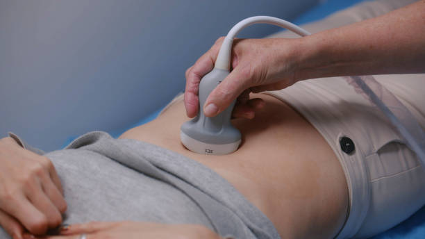 istock Medical specialist performs stomach ultrasound examination 1998374983