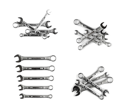 Wrenches of different sizes isolated on white background top view. Chrome spanners set, wrench collection