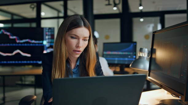 istock Upset trader working online in financial office. Stressed business manager check 1998386272