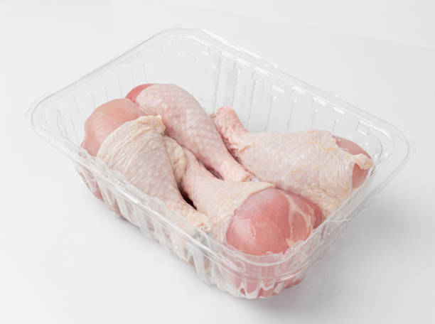 istock Raw Chicken Drumsticks in a Plastic Container Isolated, Uncooked Poultry Legs, Fresh Hen Meat 1998403120