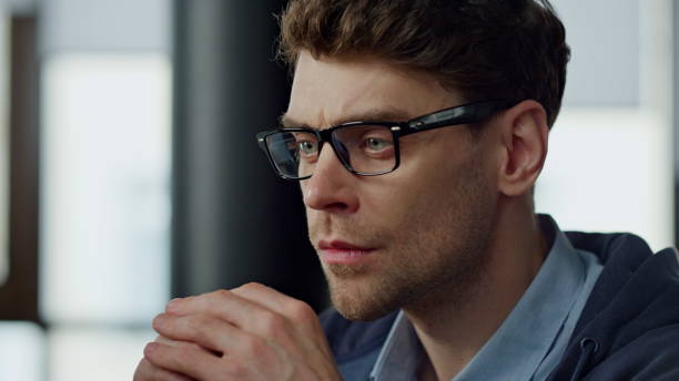 istock Closeup serious man analyzing financial report. Focused project manager checking 1998420050