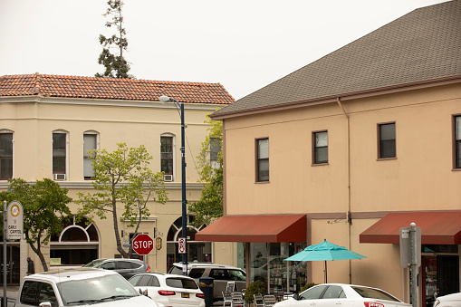 Benicia, California, USA - April 32, 2023: Afternoon foggy sunlight shines on historic downtown Benicia buildings.