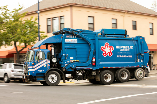 Benicia, California, USA - April 32, 2023: A Republic Services Trash truck makes a collection of garbage.