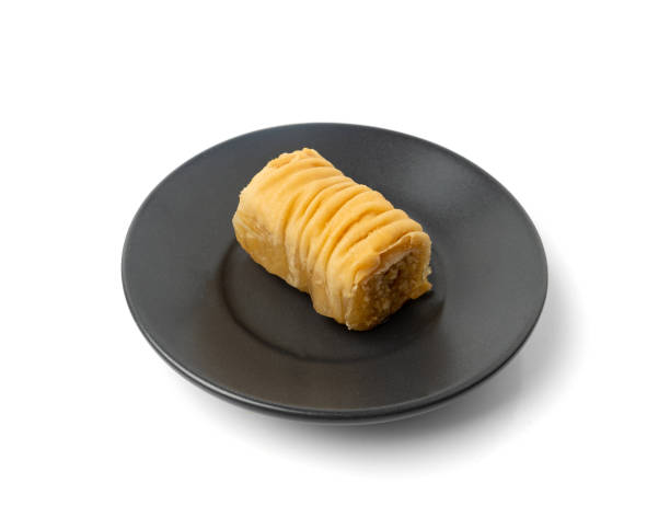 istock Rolled Baklava Isolated, Ramadan Dessert Roll on Restaurant Plate, Eastern Sweet Pastries 1998425988