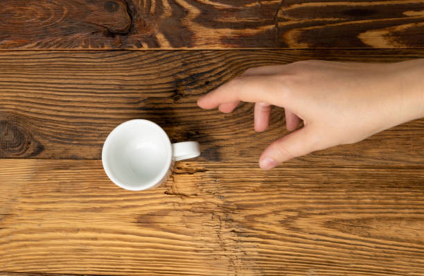 istock Hand Grabs Cup, Hands Reaching Empty Cup, Coffee Mug, Teacup, Hot Beverage Mockup, Cup in Arms 1998435837