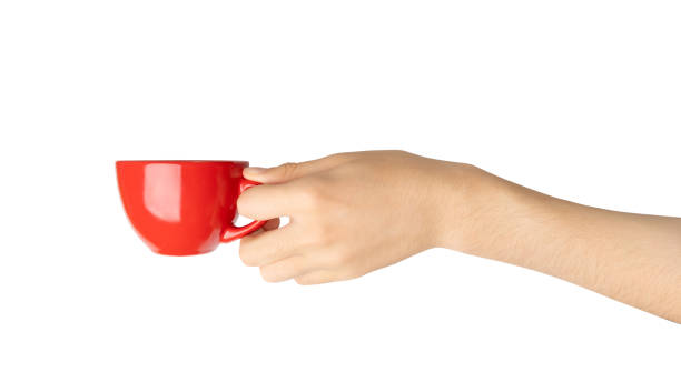 istock Hand Holds Cup Isolated, Empty Red Cup in Hands, Coffee Mug, Teacup, Hot Beverage Mockup 1998435857