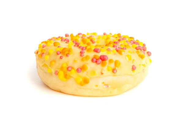 Yellow Doughnuts Isolated, Glazed Frosted Donuts with Colorful Sprinkles, Circle Cake Doughnuts on White Background