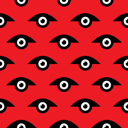 Vector seamless pattern of a graphic white and black eyes on a red background.