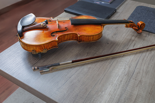 Classic violin on wooden table