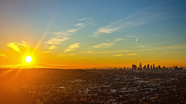 Time-lapse of sunrise behind the Los Angeles skyline from the westside of downtown